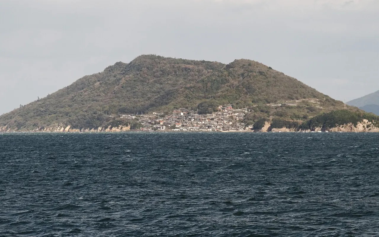 The green hills of Naoshima seen across the water from the ferry